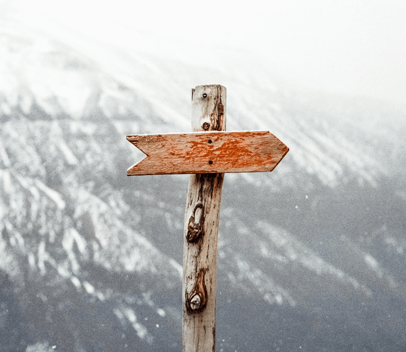 Signpost showing a direction. Change of directions can help spot a bad debtor.